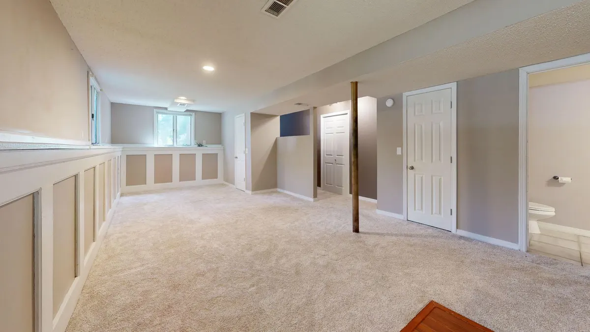 Bright finished basement with recessed lighting