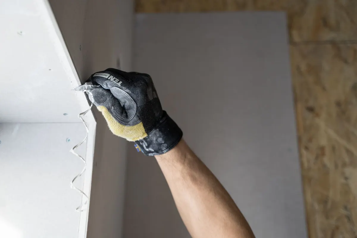 Precise drywall board cut by hand