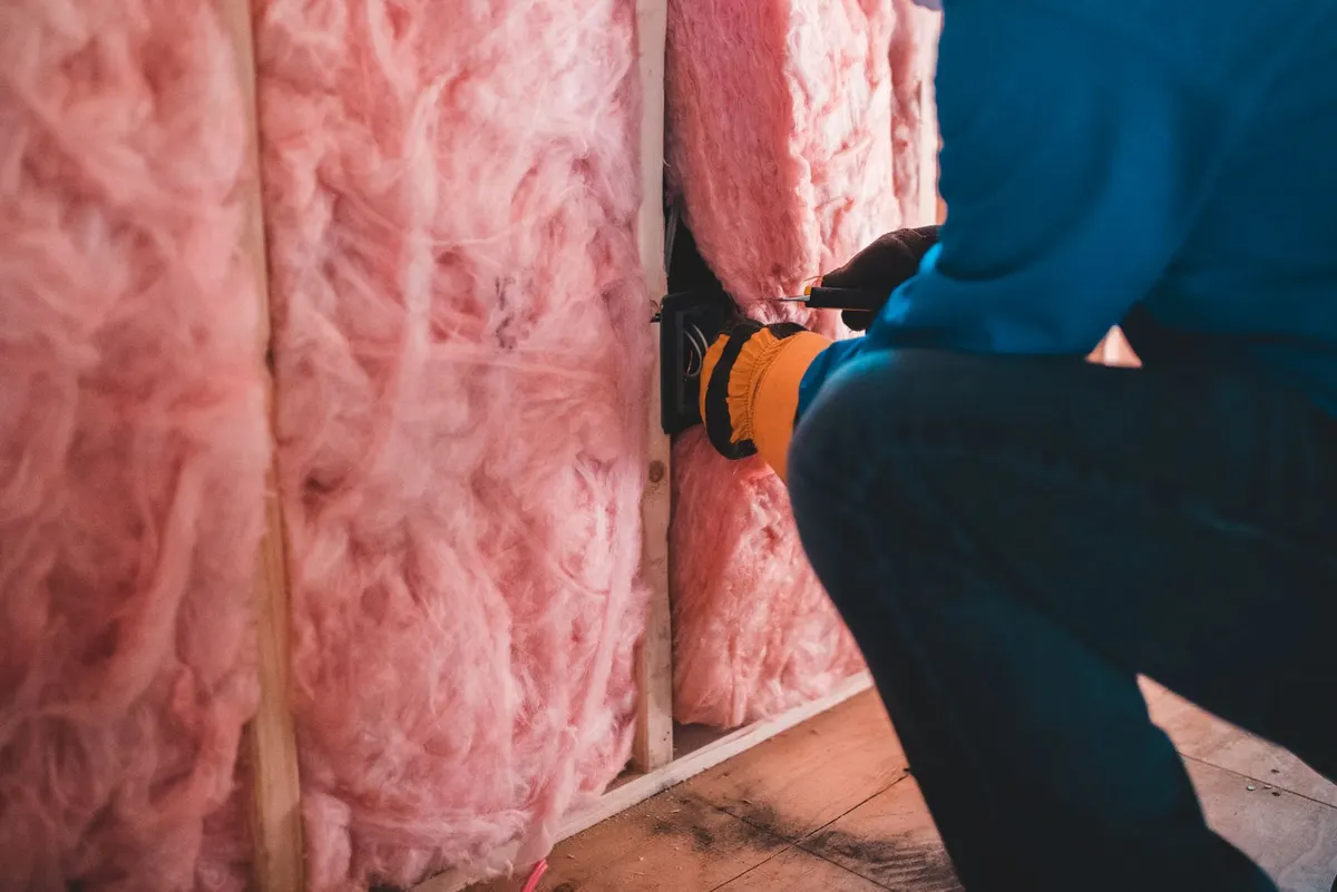 Fresh insulation batts installed between studs